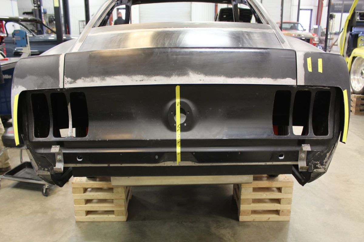 Custom 1969 Fastback Mustang with supercharged coyote engine rear bumper fabrication